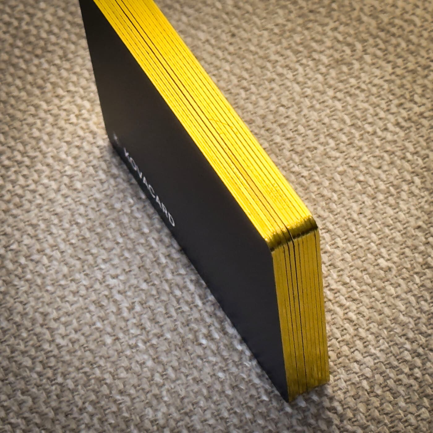 The gold foil edge of the card, close up