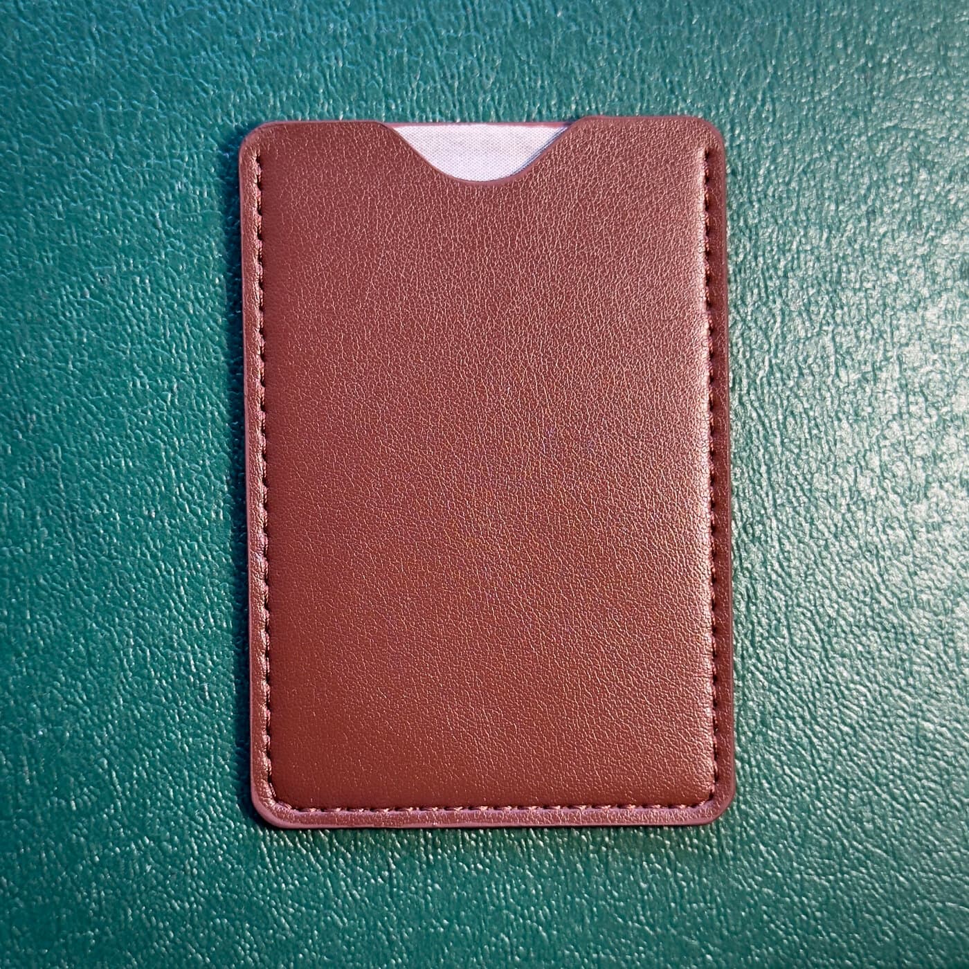 A leather pouch on a desk
