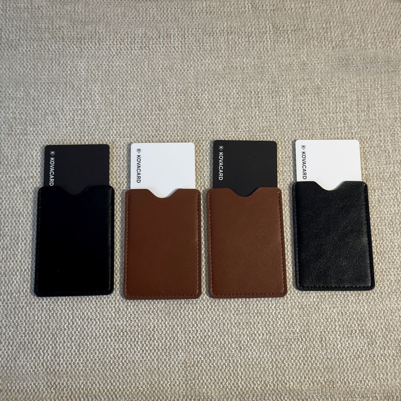 The pouch colours side by side, each holding a card